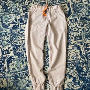 Taupe colored or pale gray fig uniform pants.